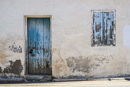 closed blue wooden door thumbnail