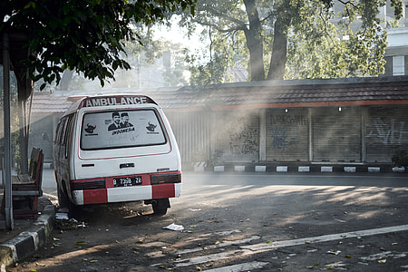 white van beside road thumbnail