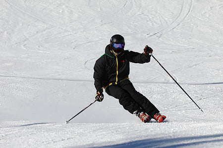 person using ski during daytime thumbnail