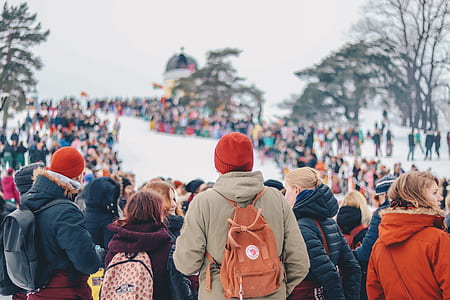 people gathering on snow field thumbnail