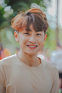 Shallow Focus Photography of Man in Beige Shirt thumbnail