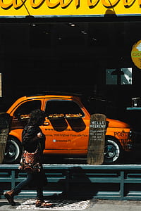 woman walking along pizza restaurant thumbnail
