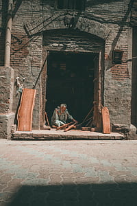 man holding lumber in building thumbnail