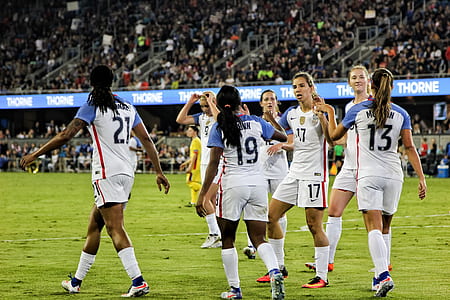 group of woman standing on field thumbnail