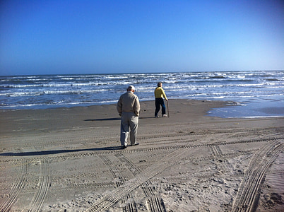 two people walking on beach at daytime thumbnail