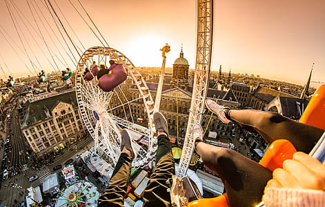 two persons riding on aerial rides thumbnail
