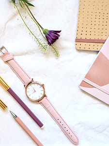 Flat lay Photography of Watch Near Pens and Notebook thumbnail