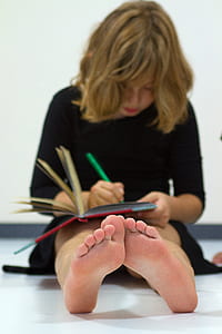 girl writing on book thumbnail