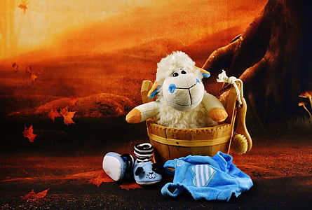 white sheep plush toy on brown bucket thumbnail