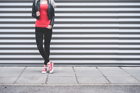 Young Woman Standing in Front of Metallic Wall thumbnail