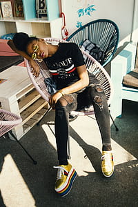 Woman Sitting and Sleeping on Chair thumbnail