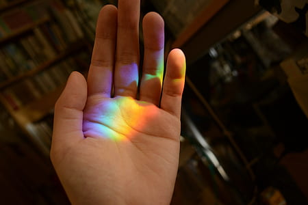 rainbow light on left person palm thumbnail
