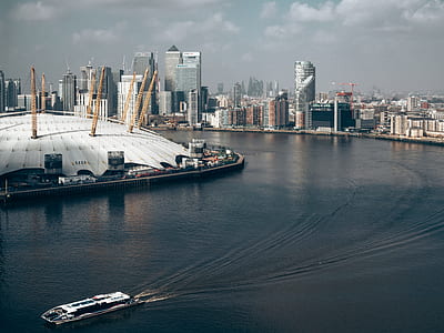 bird's-eye view photography of buildings near body of water thumbnail