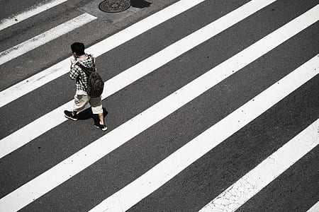 man walks on concrete road thumbnail