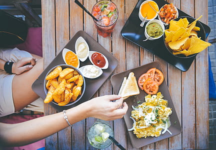 assorted food on ceramic plates thumbnail