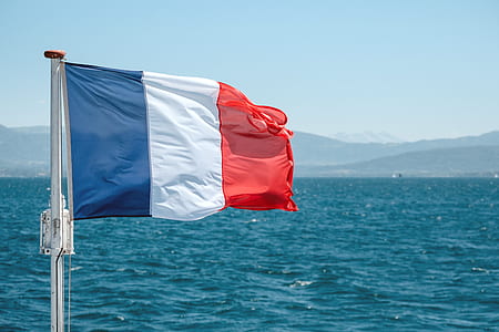 blue, white, and red striped flag on pole thumbnail