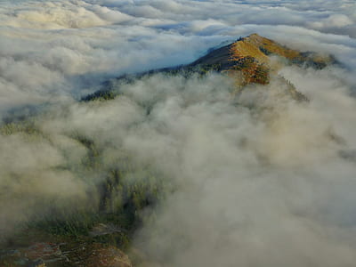 aerial photo of mountain covered with clouds thumbnail