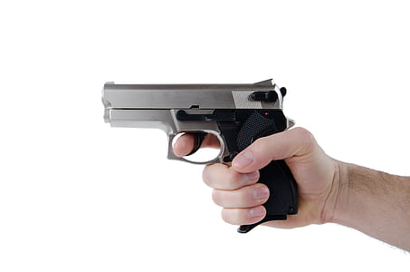 person holding gray and black semi-automatic pistol thumbnail