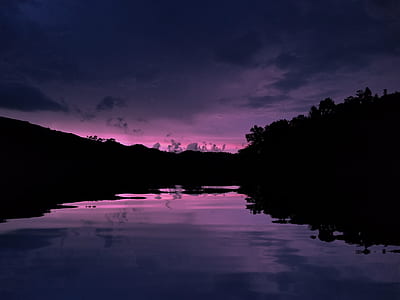 river near mountains during nighttime thumbnail