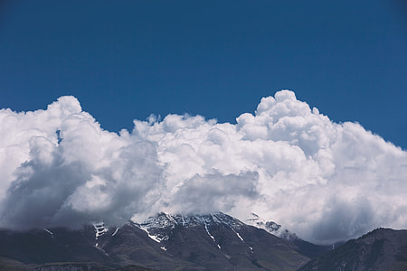 panoramic photography of white clouds over mountain thumbnail