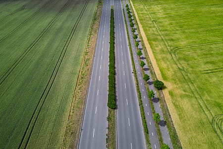Aerial view on highway by the field at summer thumbnail