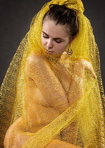 woman wearing yellow lace textile thumbnail