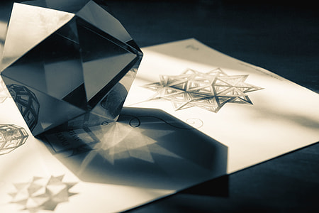 grey 3D glass paperweight on white printer paper thumbnail