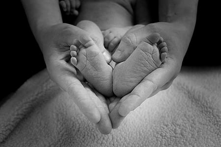 person holding the baby's feet thumbnail
