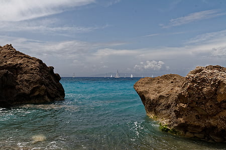 rock formations on beach shore thumbnail
