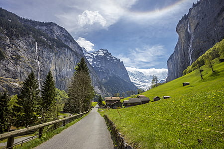 green grass field beside gray mountain thumbnail