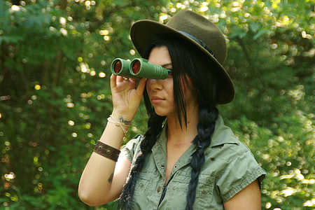 person holding green binoculars thumbnail