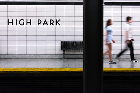 two person walking on train rail sidewalk thumbnail
