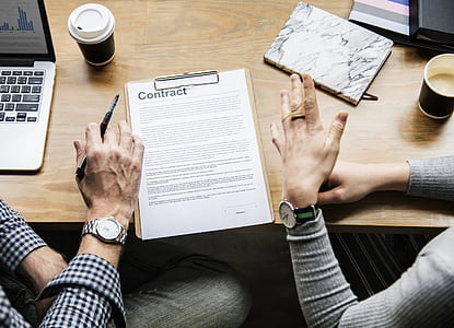 two person sitting beside table thumbnail