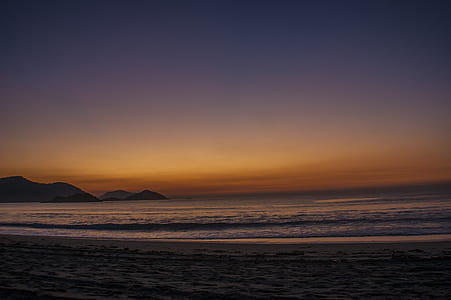 seashore near body of water during dawn thumbnail