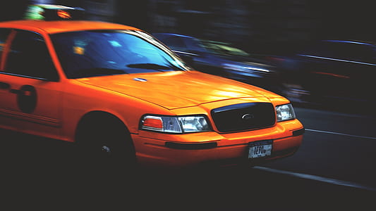 time lapse photography of orange Ford Crown Victoria sedan thumbnail