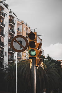 no left turn traffic signage beside traffic light in go light thumbnail