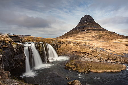 waterfall near rock formation thumbnail