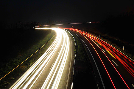 asphalt road during nighttime time lapse shot thumbnail