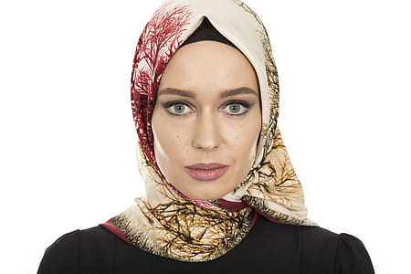 woman wears brown and red hijab headdress thumbnail