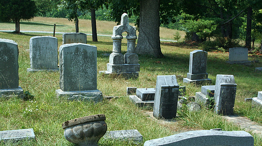 selective focus photography of tombstones thumbnail