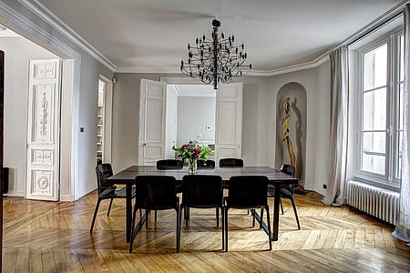 rectangular black wooden dining table with chair set inside room thumbnail