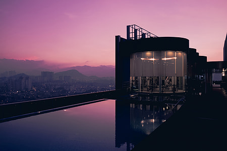 Rooftop swimming pool at sunset at a hotel in Malaysia thumbnail