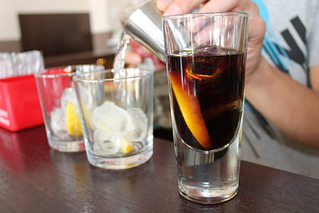 black liquid inside clear shot glass thumbnail