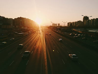 vehicle on road during golden hour thumbnail
