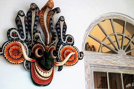 brown and gray mask decor on wall thumbnail