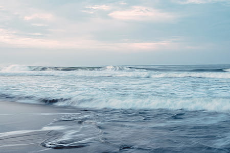 body of water under cloudy sky thumbnail