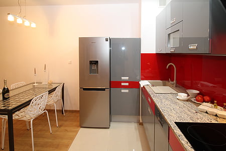 gray refrigerator beside gray cabinet thumbnail