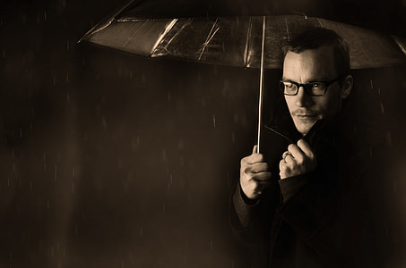 man holding umbrella thumbnail