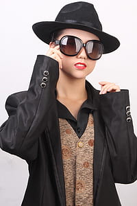 women's black hat and oversized sunglasses thumbnail