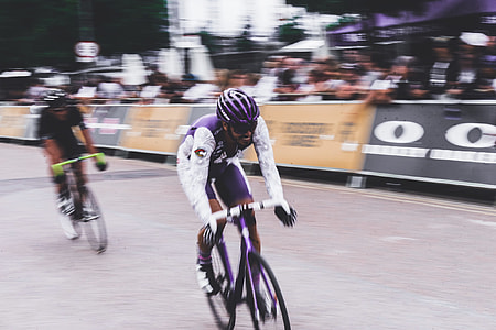 two men competing bike race during daytime thumbnail